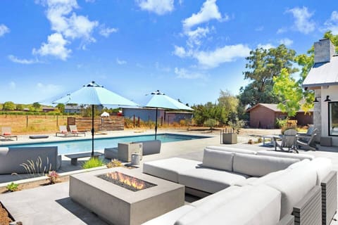 A fire pit with pool views to cozy up with a glass of Carneros Pinot Noir.