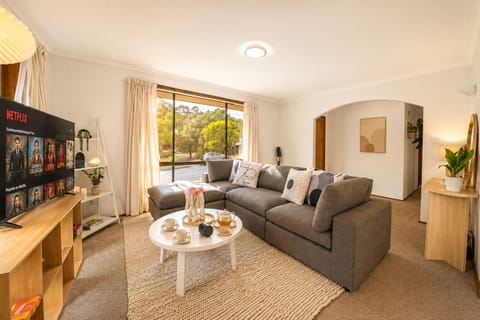 Open living space with large windows and seating