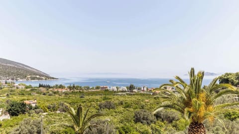 Garden View with Mediterranean Plants and Sea in Distance