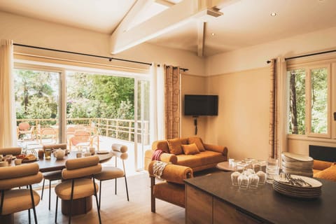 A bright and open dining space overlooking the gardens — perfect for shared meals in a calm setting.