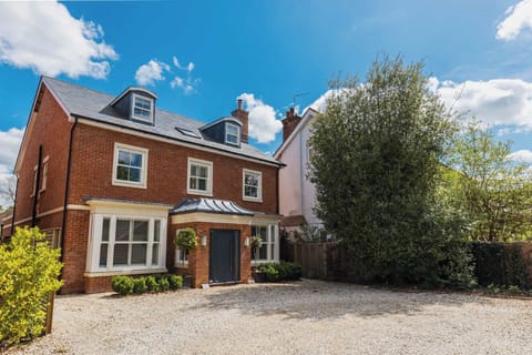 A handsome detached retreat in northern Chichester with generous driveway parking for five cars.