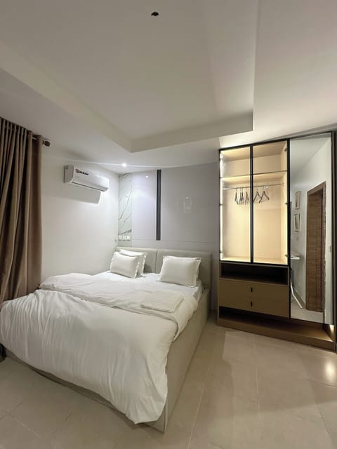 Deluxe Apartment, Balcony, City View | In-room safe, desk, laptop workspace, blackout drapes