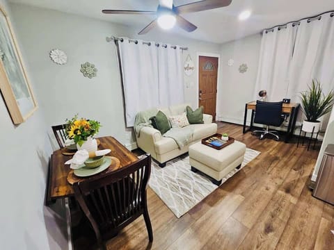 Cozy living area with workspace and dining for two