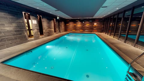 Unwind with serene indoor swims in the glowing heated pool.