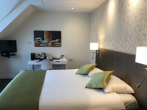 Recharge in a calm room with bedside lighting and workspace.