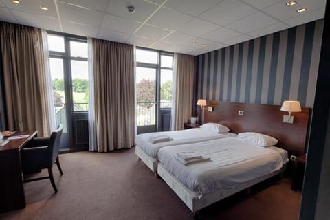 Wake to leafy views from your bright, airy bedroom.