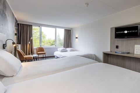 Breathe easy in an airy room with calming window outlook.