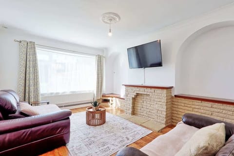 Unwind in our cozy living room featuring a smart TV for movie nights.