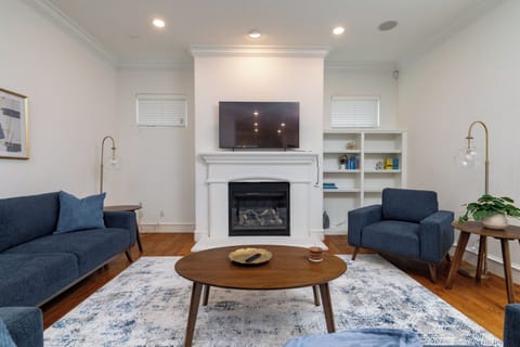Cozy living room with a modern fireplace and mounted TV.
