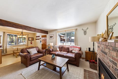 Cozy living room with fireplace and rustic charm