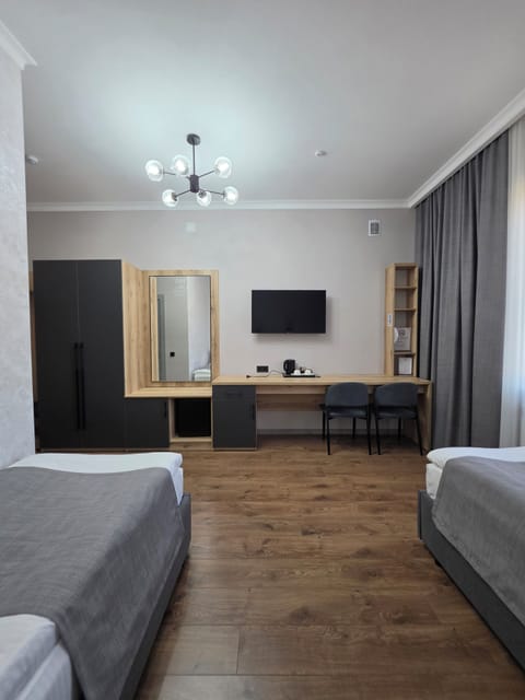 Standard Twin Room, Private Bathroom | Desk, laptop workspace, blackout drapes, soundproofing