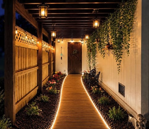 Welcome to Maya’s Romantic Waterfront—where every detail, starting with the charming side walkway, sets the tone for an unforgettable romantic escape.