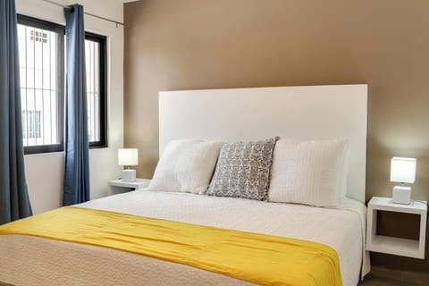 King bed, hair dryer, iron and security box in the bedroom