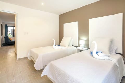 Bedroom, two twin beds, security box, air conditioning, iron, hair dryer, closet
