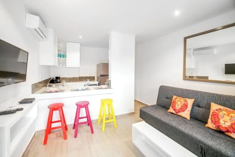 Living room, kitchen and dining. Sofa folds flat for an extra sleeping space 