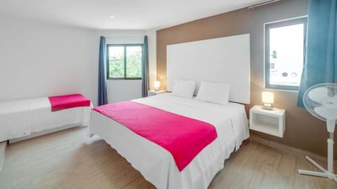 Large room with two beds with air conditioning, security box, hair dryer and iron