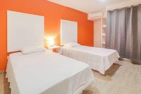 Two twin beds, security box, hangers, iron, hair dryer