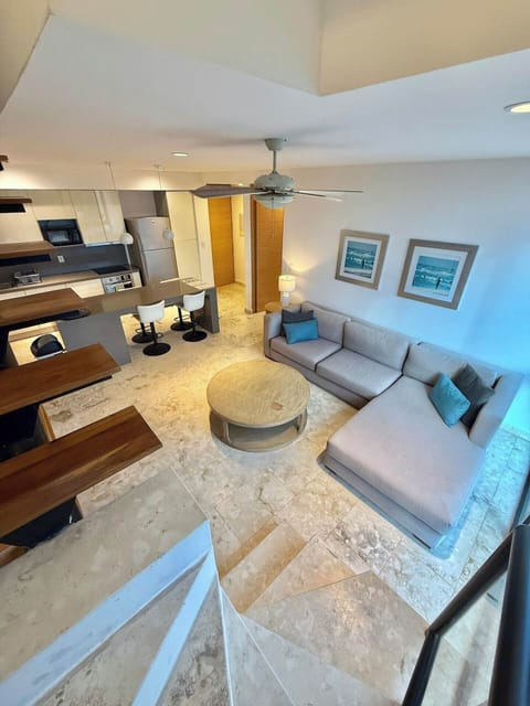Living room, smart tv, L shaped couch. Couch can be pushed together for double bed.