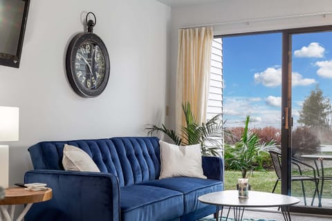 A futon sofa bed graces the room, with a captivating lake view accessible from the adjacent balcony.