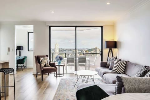 Lounge area with large balcony overlooking Sydney harbour and study area.