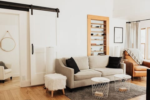 Relax with West Elm furnishings in the open living space and 14 foot ceilings as tons of natural light shines in. 