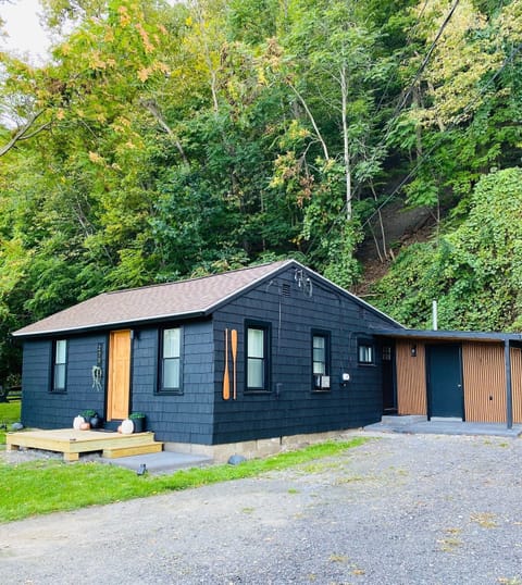 Moody in black with a cedar door, we love how it tucks itself away amongst the trees. 