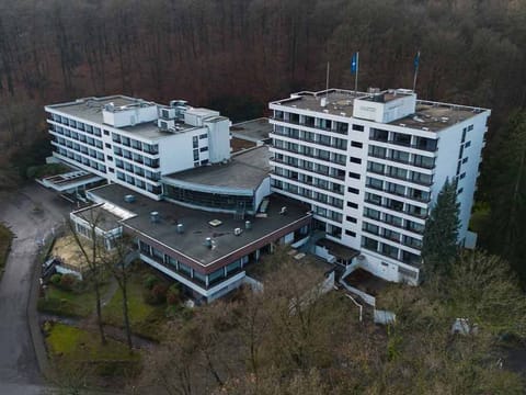Arrive to a resort-style retreat nestled beside peaceful woods.