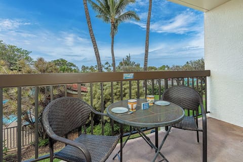 Start your mornings with coffee on your private balcony, surrounded by swaying palms and a peak-a-boo path toward the ocean.