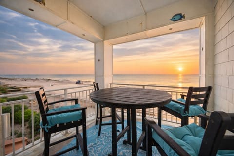 Dine with a view—sunrise over the Atlantic from your private oceanfront balcony