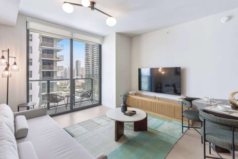 Bright living space with stylish seating and city views