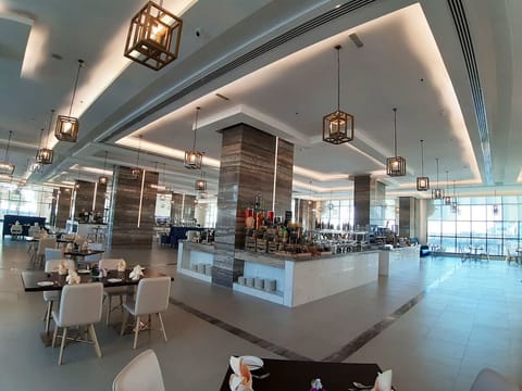 Start your day with a generous buffet in a bright hall.