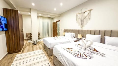 Deluxe Triple Room, Balcony, City View | In-room safe, blackout drapes, soundproofing
