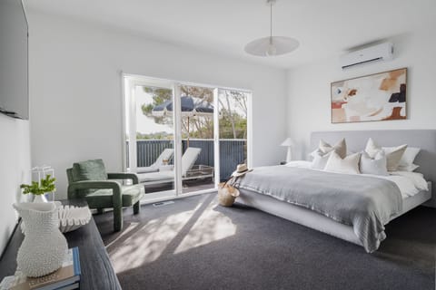 King bed, ensuite bathroom, walk in wardrobe, split system, smart TV and access to balcony
