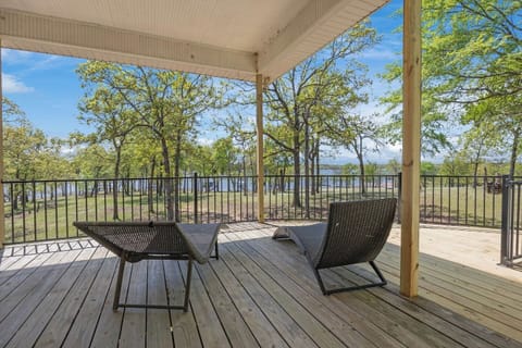 Lounge chairs overlooking the lake on the covered patio