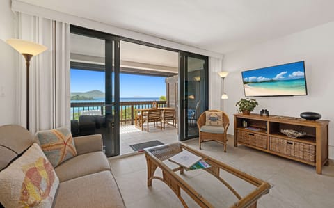 Relax and unwind in the comfortable living space with breathtaking ocean views just beyond the balcony.