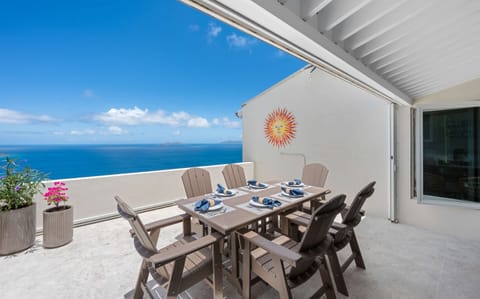 Large balcony with outdoor dining and incredible views
