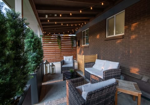 String-lit covered patio with premium lounge seating