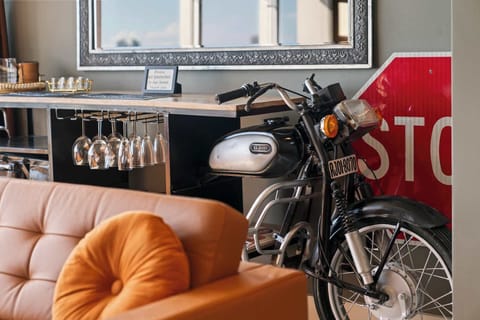 Character in every corner, check out the vintage motorcycle decor and coffee bar station.