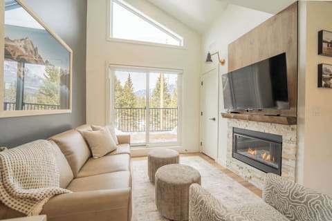 Cozy living area with fireplace, flat screen tv and sofa bed with incredible views!