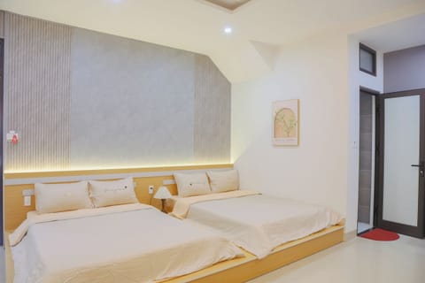 Family Quadruple Room, City View | Desk, laptop workspace, free WiFi