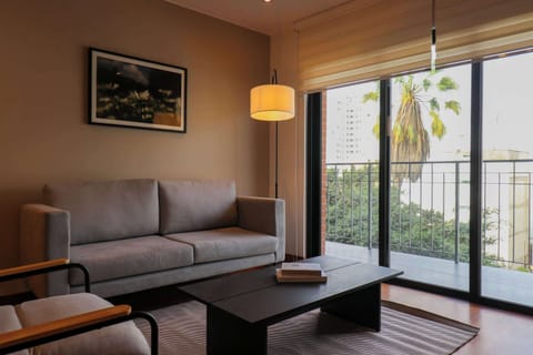 Bright living room with balcony access and natural light
