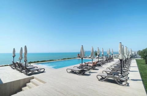 Seasonal outdoor pool, pool umbrellas, sun loungers