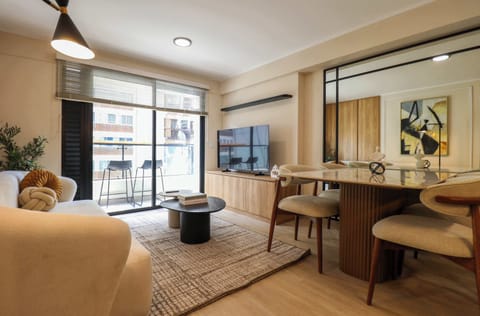 Bright living area with cozy dining area, perfect for relaxing or working comfortably.