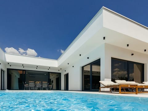 Outdoor pool, a heated pool, open open 24 hours, pool umbrellas