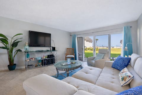 Living room with ground floor access to patio