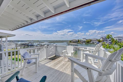 Unwind on your private deck with stunning water views, where classic white Adirondack chairs invite morning coffee moments and evening relaxation.