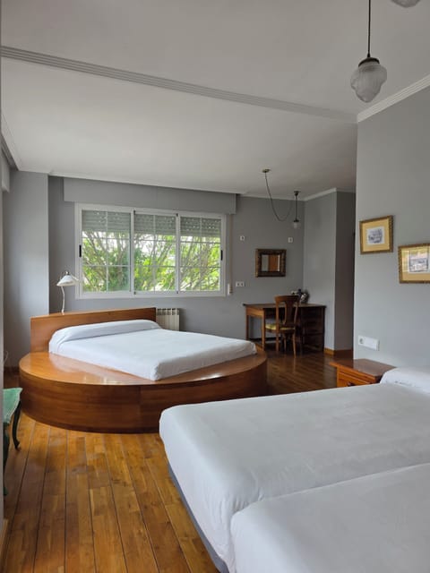 Quadruple Room, Balcony, Garden View | Desk