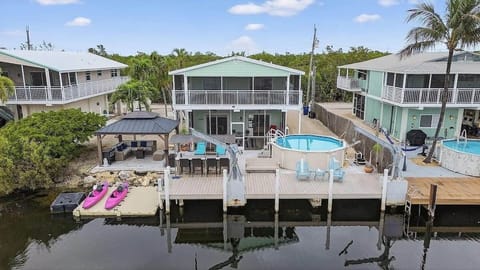 Enjoy the canal-view patio with pool, seating, and sunny outdoor space.