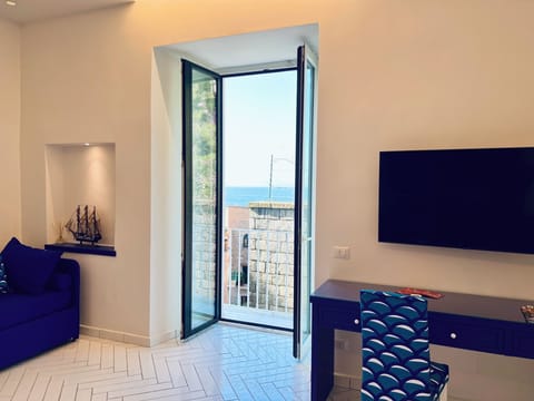 Apartment, Balcony, Partial Sea View | Living area | 32-inch flat-screen TV with digital channels