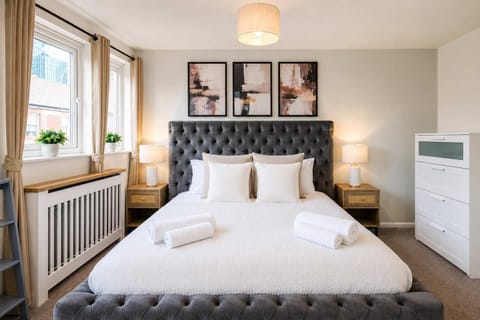 Elegant Bedroom: Bright and stylish retreat with plush bedding and chic decor awaits your stay!